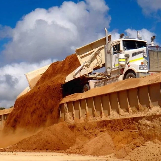 Mining haul truck unloading extracted material